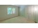 Bedroom with natural light from a window and ample closet space at 800 Greenwood Se Trl, Conyers, GA 30094