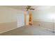 Bedroom with ceiling fan, neutral carpet, closet and two toned wall paint at 800 Greenwood Se Trl, Conyers, GA 30094