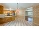 Checkered floors and hardwood floors border the kitchen and dining room, offering an open floor plan at 800 Greenwood Se Trl, Conyers, GA 30094