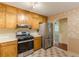 Stainless steel appliances and hardwood floors add a modern touch to this well-appointed kitchen at 800 Greenwood Se Trl, Conyers, GA 30094