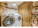 Functional laundry room with washer, dryer and convenient storage, ready for use at 800 Greenwood Se Trl, Conyers, GA 30094