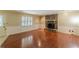 Inviting living room featuring a brick fireplace, wood floors, wainscoting, and plenty of natural light at 800 Greenwood Se Trl, Conyers, GA 30094