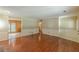 Spacious living room featuring wood floors, neutral walls, and an open layout with access to other rooms at 800 Greenwood Se Trl, Conyers, GA 30094