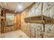 Interior space with exposed insulation and shelving, suitable for storage or renovation at 800 Greenwood Se Trl, Conyers, GA 30094