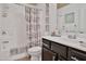 Bathroom with a shower, vanity, toilet, and decorated with four similar art pieces at 2626 Sardis Chase Ct, Buford, GA 30519