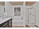 Spacious bathroom with a walk-in shower, bathtub, and dark wooden vanity at 2626 Sardis Chase Ct, Buford, GA 30519