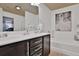 Bright bathroom featuring a bathtub and shower combination with a large framed art piece at 2626 Sardis Chase Ct, Buford, GA 30519