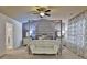 Serene bedroom with a four-poster bed, elegant curtains, and plenty of natural light at 2626 Sardis Chase Ct, Buford, GA 30519