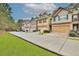 Charming townhomes featuring attached garages and well-manicured lawns at 2626 Sardis Chase Ct, Buford, GA 30519