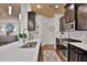 Spacious kitchen featuring a large island with dark cabinetry and modern stainless appliances at 2626 Sardis Chase Ct, Buford, GA 30519