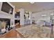 Open-concept living space with modern décor, a fireplace, and sleek hardwood flooring at 2626 Sardis Chase Ct, Buford, GA 30519