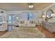 Cozy living room features hardwood floors, stylish decor, and ample natural light at 2626 Sardis Chase Ct, Buford, GA 30519