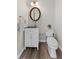 Compact half bathroom featuring modern fixtures and a clean, minimalist design at 479 Rising Sun Path, Lawrenceville, GA 30043