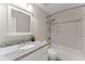 Bathroom featuring a single sink vanity with granite countertops and tub-shower combo at 479 Rising Sun Path, Lawrenceville, GA 30043