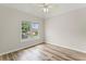 Bedroom with hardwood floors, ceiling fan and window at 479 Rising Sun Path, Lawrenceville, GA 30043