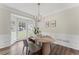 Bright dining area with large windows, perfect for enjoying meals with natural light at 479 Rising Sun Path, Lawrenceville, GA 30043