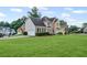 Beautiful two-story home with a spacious front yard and attached two-car garage at 479 Rising Sun Path, Lawrenceville, GA 30043