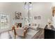 Bright living room with fireplace, high ceilings, and access to outdoor deck at 479 Rising Sun Path, Lawrenceville, GA 30043