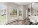 Sun-drenched living room with large windows, fireplace, and open floor plan at 479 Rising Sun Path, Lawrenceville, GA 30043