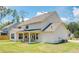 Spacious backyard with lush lawn and covered patio, offering a serene and private outdoor space at 774 Phil Haven Ln, Kennesaw, GA 30152
