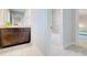 Bathroom featuring white tiled floors, a granite vanity, and an alcove tub/shower at 774 Phil Haven Ln, Kennesaw, GA 30152