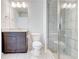 Bathroom featuring tiled walk-in shower, granite countertop vanity and tile flooring at 774 Phil Haven Ln, Kennesaw, GA 30152
