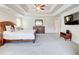 A primary bedroom boasts a tray ceiling and has carpeted floors, and neutral paint at 774 Phil Haven Ln, Kennesaw, GA 30152