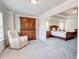 Sitting area with a plush recliner situated right next to the spacious primary bedroom at 774 Phil Haven Ln, Kennesaw, GA 30152