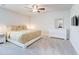 Bedroom featuring a ceiling fan, carpeted floor, a window, and light wood furniture at 774 Phil Haven Ln, Kennesaw, GA 30152