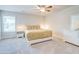 Bedroom featuring a ceiling fan, carpeted floor, a window, and light wood furniture at 774 Phil Haven Ln, Kennesaw, GA 30152