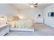 Bedroom featuring a ceiling fan, carpeted floor, a window, and light wood furniture at 774 Phil Haven Ln, Kennesaw, GA 30152