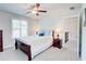 Comfortable bedroom with neutral carpet, two windows and ceiling fan at 774 Phil Haven Ln, Kennesaw, GA 30152