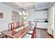 Dining room with hardwood floors, pendant lighting, and wet bar at 774 Phil Haven Ln, Kennesaw, GA 30152