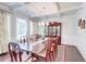 Dining room with hardwood floors, large table, and coffered ceilings at 774 Phil Haven Ln, Kennesaw, GA 30152