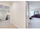 Second floor hallway leading to bedroom with a lot of natural light at 774 Phil Haven Ln, Kennesaw, GA 30152