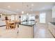 Bright open-concept kitchen area with stainless steel appliances and island with bar seating at 774 Phil Haven Ln, Kennesaw, GA 30152