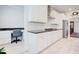 Open kitchen and office nook with granite counters and stainless steel appliances at 774 Phil Haven Ln, Kennesaw, GA 30152