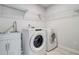 Bright laundry room featuring large appliances and sink with lots of storage space at 774 Phil Haven Ln, Kennesaw, GA 30152