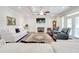 Inviting living room with a fireplace, hardwood floors, and a serene view at 774 Phil Haven Ln, Kennesaw, GA 30152