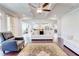 Spacious living room with hardwood floors, fireplace, and furniture at 774 Phil Haven Ln, Kennesaw, GA 30152