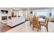 Open concept living area with hardwood floors, fireplace, and large windows at 774 Phil Haven Ln, Kennesaw, GA 30152