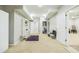 Finished basement area with neutral carpet, study nook and access to an additional room at 840 Milton Oaks Dr, Johns Creek, GA 30022