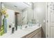 Bright bathroom featuring a large vanity and large mirror at 840 Milton Oaks Dr, Johns Creek, GA 30022