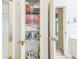 Organized bathroom closet, complete with towels, toiletries, and cleaning supplies on wire shelving at 840 Milton Oaks Dr, Johns Creek, GA 30022