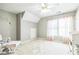 Charming Bedroom with soft colors, ample natural light and room for relaxation at 840 Milton Oaks Dr, Johns Creek, GA 30022