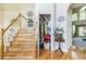 Inviting foyer with hardwood floors, staircase and an open closet offering lots of storage at 840 Milton Oaks Dr, Johns Creek, GA 30022