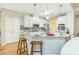 Bright, modern kitchen with granite countertops, stainless steel appliances, and breakfast bar seating at 840 Milton Oaks Dr, Johns Creek, GA 30022