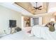 Comfortable main bedroom featuring a trey ceiling with ceiling fan and ensuite bathroom at 840 Milton Oaks Dr, Johns Creek, GA 30022
