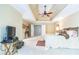Spacious main bedroom featuring a trey ceiling with ceiling fan and ensuite bathroom at 840 Milton Oaks Dr, Johns Creek, GA 30022