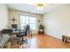 Well-lit office space with hardwood floors and a ceiling fan for added comfort at 840 Milton Oaks Dr, Johns Creek, GA 30022